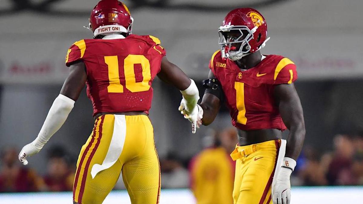  Sep 20, 2025; Los Angeles, California, USA; Southern California Trojans defensive end Braylan Shelby (10) celebrates with defensive end Kameryn Crawford (1) after bringing down Michigan State Spartans quarterback Aidan Chiles (2) during the first half at the Los Angeles Memorial Coliseum. Mandatory Credit: Gary A. Vasquez-Imagn Images | Gary A. Vasquez-Imagn Images 