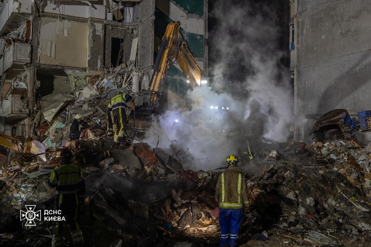 Firefighters work at a site of the apartment building damaged during yesterday's Russian missile and drone strike, amid Russia's attack on Ukraine, in Kyiv, Ukraine in this handout picture released May 15, 2026. Press service of the State Emergency Service of Ukraine in Kyiv/Handout via REUTERS