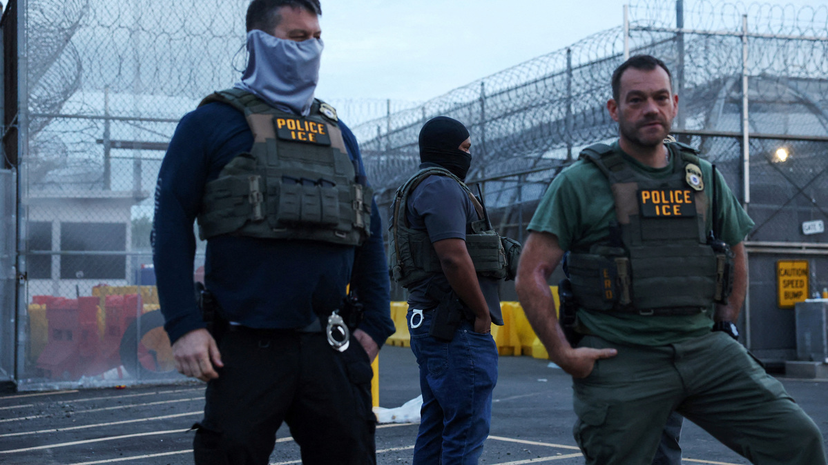 U.S. Immigration and Customs Enforcement (ICE) agents stand outside an entrance of Delaney Hall in Newark, New Jersey, U.S., May 27, 2026. REUTERS/Shannon Stapleton