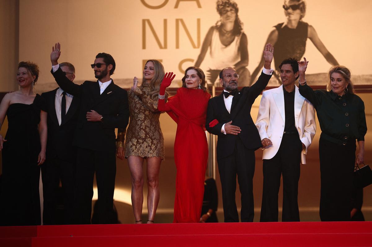 Director Asghar Farhadi and cast members Vincent Cassel, Virginie Efira, Isabelle Huppert, Catherine Deneuve, Pierre Niney, Adam Bessa and India Hair pose on the red carpet during arrivals for the screening of the film "Histoires paralleles" (Parallel Tales) in competition at the 79th Cannes Film Festival in Cannes, France, May 14, 2026. REUTERS/Marko Djurica