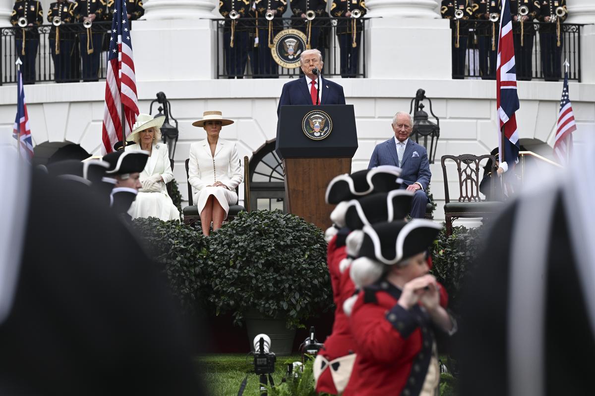 From right: King Charles III, President Donald Trump, first lady Melania Trump and Queen Camilla watch as members of the U.S. Army Old Guard Fife and Drum Corps perform during an arrival ceremony on the South Lawn of the White House in Washington, on Tuesday, April 28, 2026. (Kenny Holston/The New York Times)