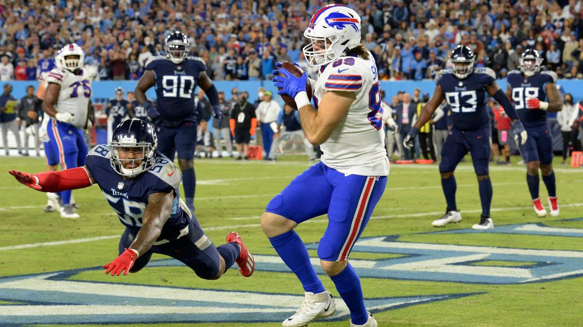Buffalo Bills tight end Tommy Sweeney (89) catches a touchdown pass as he is defended by Tennessee Titans linebacker Harold Landry III (58) in the second half of an NFL football game Monday, Oct. 18, 2021, in Nashville, Tenn. (AP Photo/Mark Zaleski)