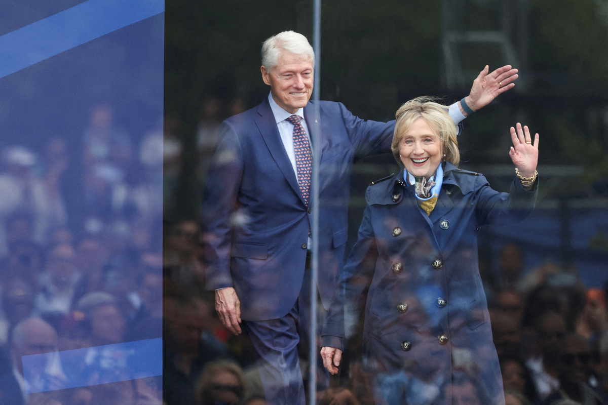 Former U.S. President Bill Clinton and former U.S. Secretary of State Hillary Clinton attend a dedication ceremony for the opening of the Obama Presidential Center, in Chicago, Illinois, U.S., June 18, 2026. REUTERS/Brendan McDermid