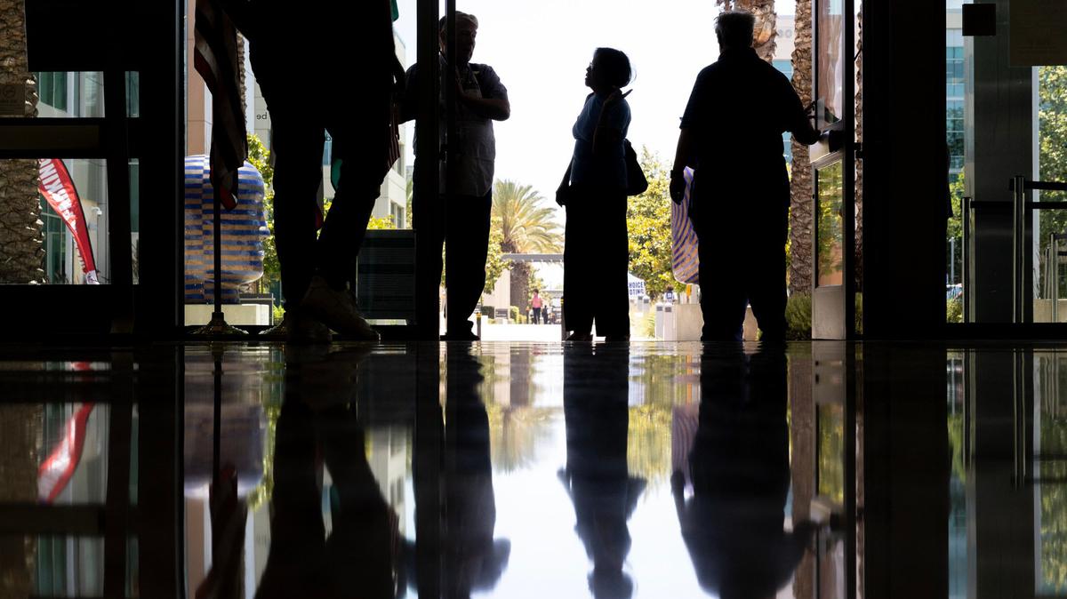 People enter the San Diego Registrar of Voters to cast ballots, register to vote and update their current registration on June 1, 2026, in San Diego.