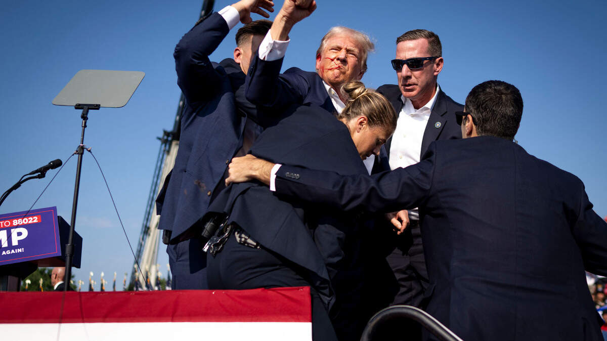 President Donald Trump is surrounded by secret service agents after being shot during a campaign rally in Butler, Pa., on July 13, 2024. Thomas Crooks was a nerdy engineering student on the dean’s list but he stockpiled explosive materials for months before his attack on Trump as his mental health eroded.