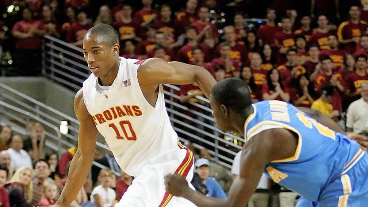  January 11, 2009; Los Angeles, CA, USA; Southern California Trojans forward DeMar DeRozan (10) moves the ball past UCLA Bruins guard Jrue Holiday (21) during the second half at the Galen Center. UCLA defeated Southern California 64-60. Mandatory Credit: Gary A. Vasquez-Imagn Images | Gary A. Vasquez-Imagn Images 