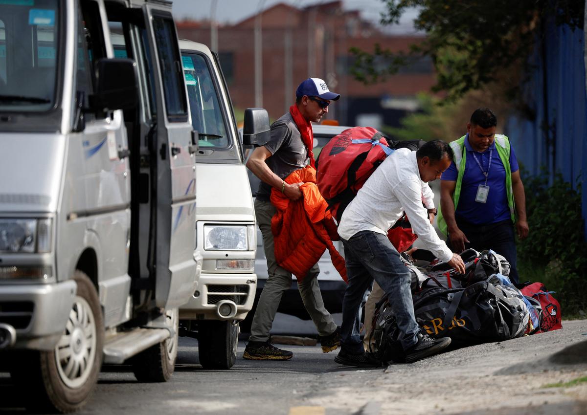 British climber Kenton Cool, 49, walks out from the airport, as he returns after completing his 17th ascent of Mount Everest, which is the most by any foreign climber, in Kathmandu, Nepal May 19, 2023. REUTERS/Navesh Chitrakar