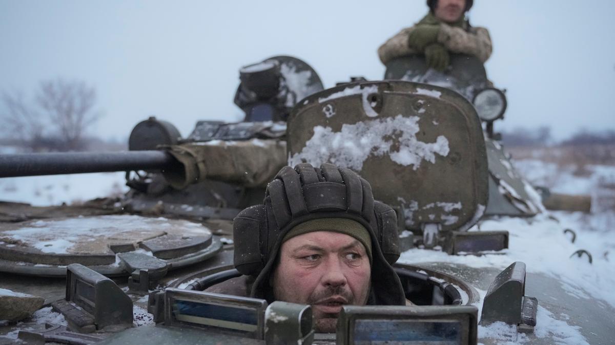 Ukrainians drive in an armored personnel carrier in eastern Ukraine on Jan. 28, as concerns about a Russian invasion rise.