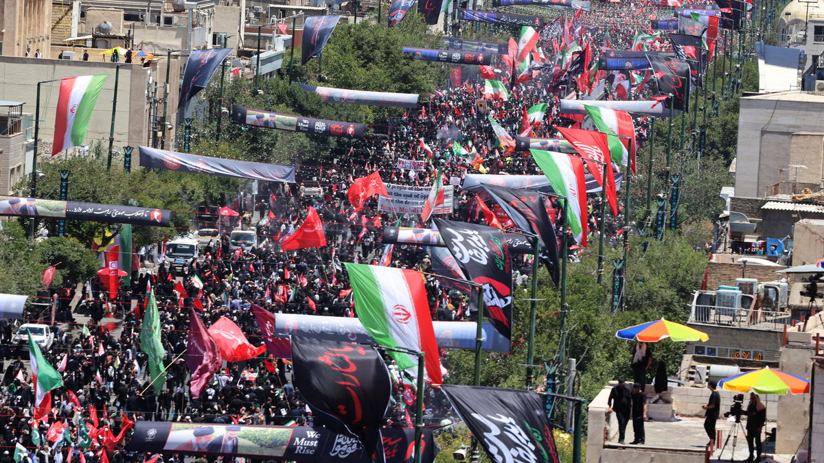 Mourners gather in the street ahead of the funeral of Iran's slain supreme leader Ali Khamenei and members of his family at the Shrine of Imam Reza, Iran's most revered place of worship, in Mashhad on July 9, 2026. A plane carrying the coffin of late Iranian supreme leader Ali Khamenei landed in the eastern holy city of Mashhad on July 9, ahead of his burial, state media reported. (Atta Kenare/AFP/Getty Images/TNS)