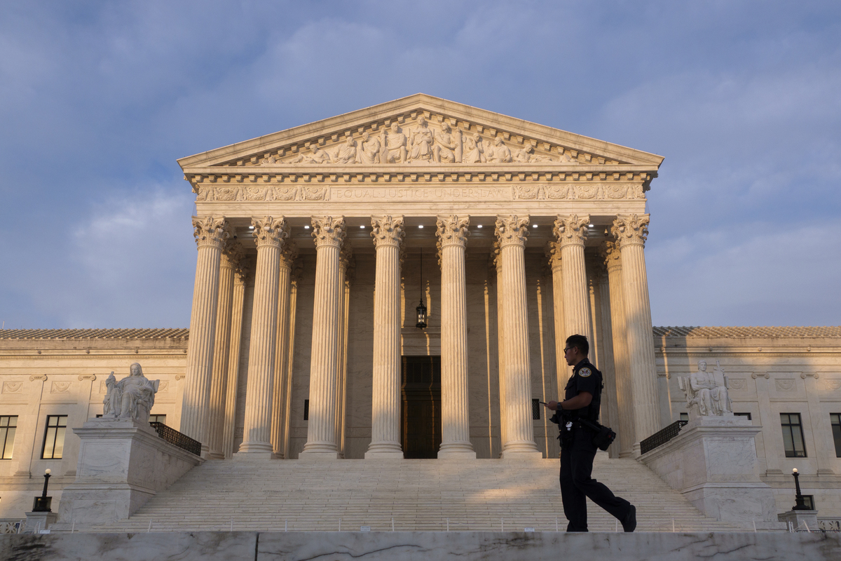  A police officer walks in front of the U.S. Supreme Court building on June 6, 2026, in Washington, D.C. 