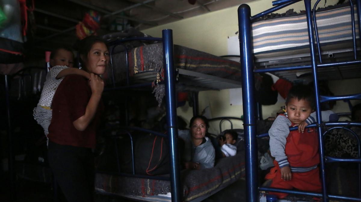 FILE - Migrants rest in a dormitory of the Good Samaritan shelter in Juarez, Mexico, March 29, 2022. The vast majority of people staying at the shelter are women and their children from Mexico and Central America who have been expelled under Title 42 authority or were still waiting to try for asylum, according to Pastor Juan Fierro, the shelter’s director. (AP Photo/Christian Chavez, File)