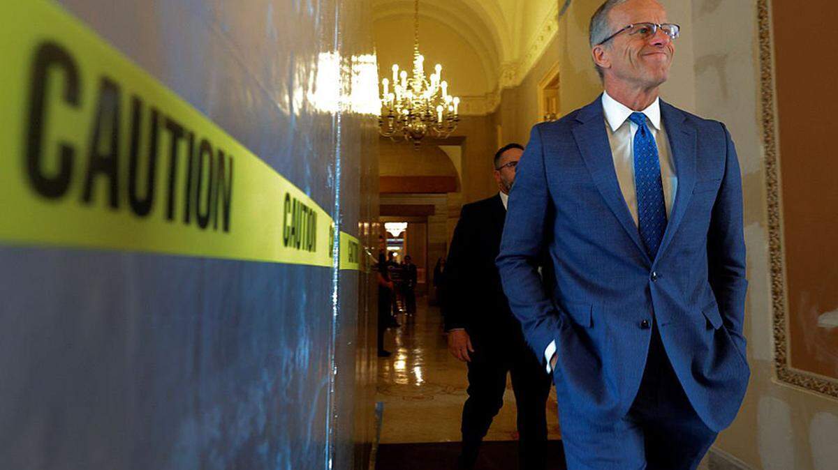 Senate Majority Leader John Thune (R-S.D.) walks to the Senate Chamber at the U.S. Capitol in Washington on Monday. Back after a week off, Thune and Senate Republicans are navigating President Donald Trump's "anti-weaponization" fund and its impact on the possibility of passing a reconciliation bill this week.
