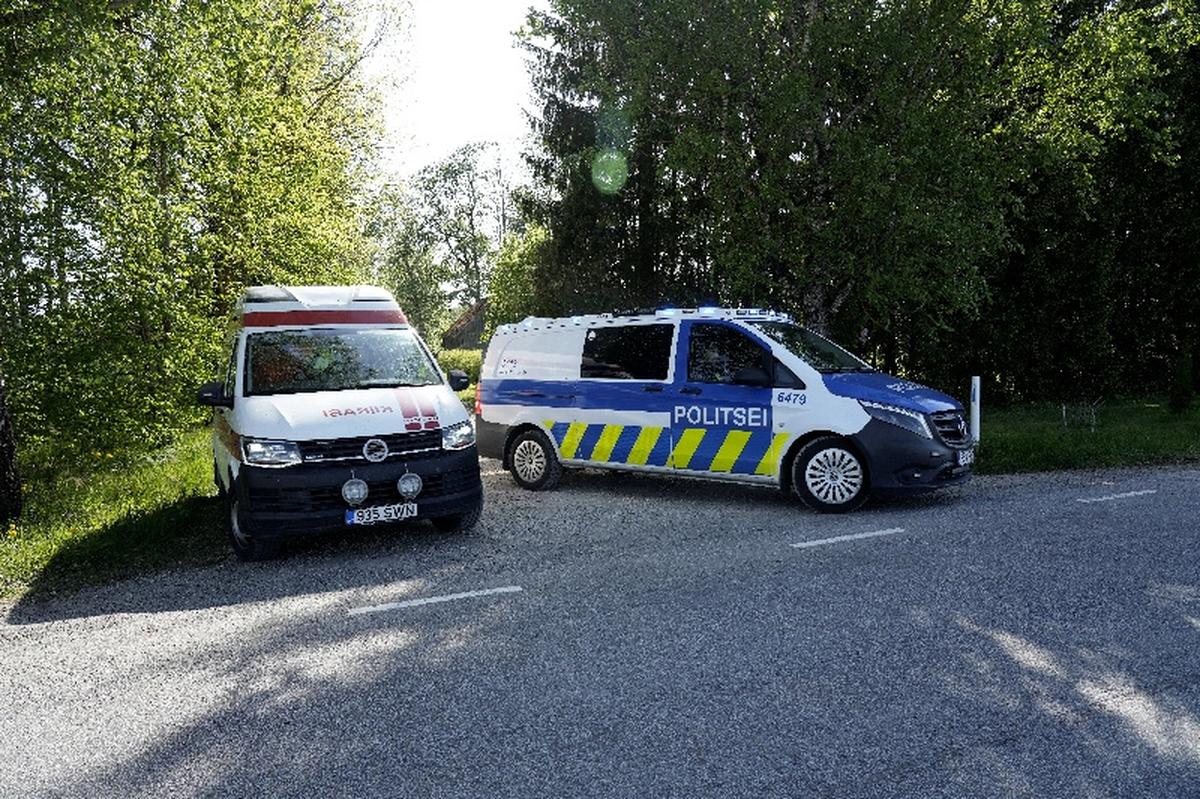 Police guard the perimeter of a drone crash site as an ambulance leaves, near Kablakula village, Estonia May 19, 2026. REUTERS/Ints Kalnins