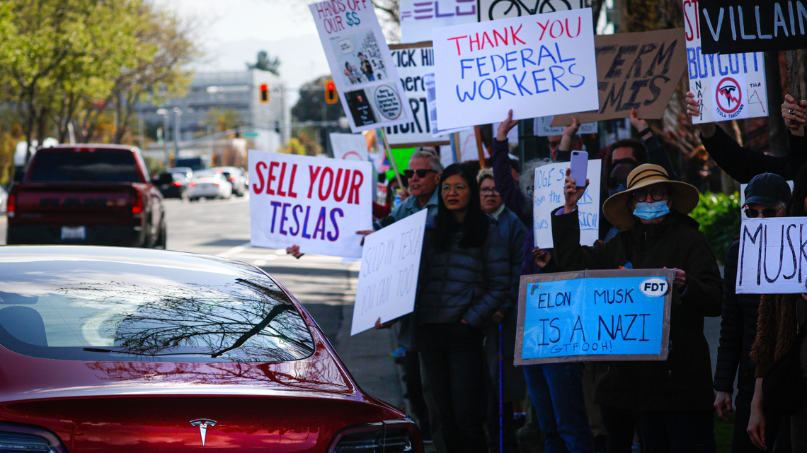 Anti-Elon Musk protester charged, accused of hitting pro-Musk counterprotester with car