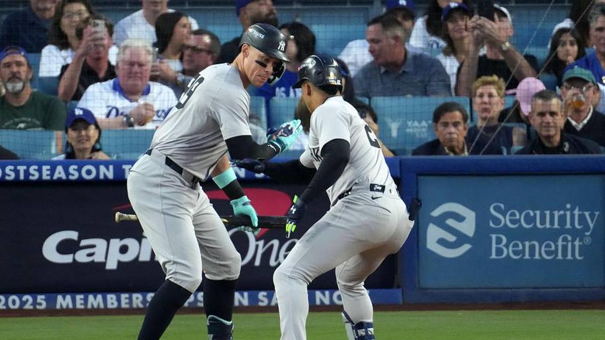  New York Yankees outfielder Juan Soto (22) reacts with outfielder Aaron Judge (99) wafter hitting a home run against the Los Angeles Dodgers in the third inning for game two of the 2024 MLB World Series at Dodger Stadium. | Kirby Lee-Imagn Images 