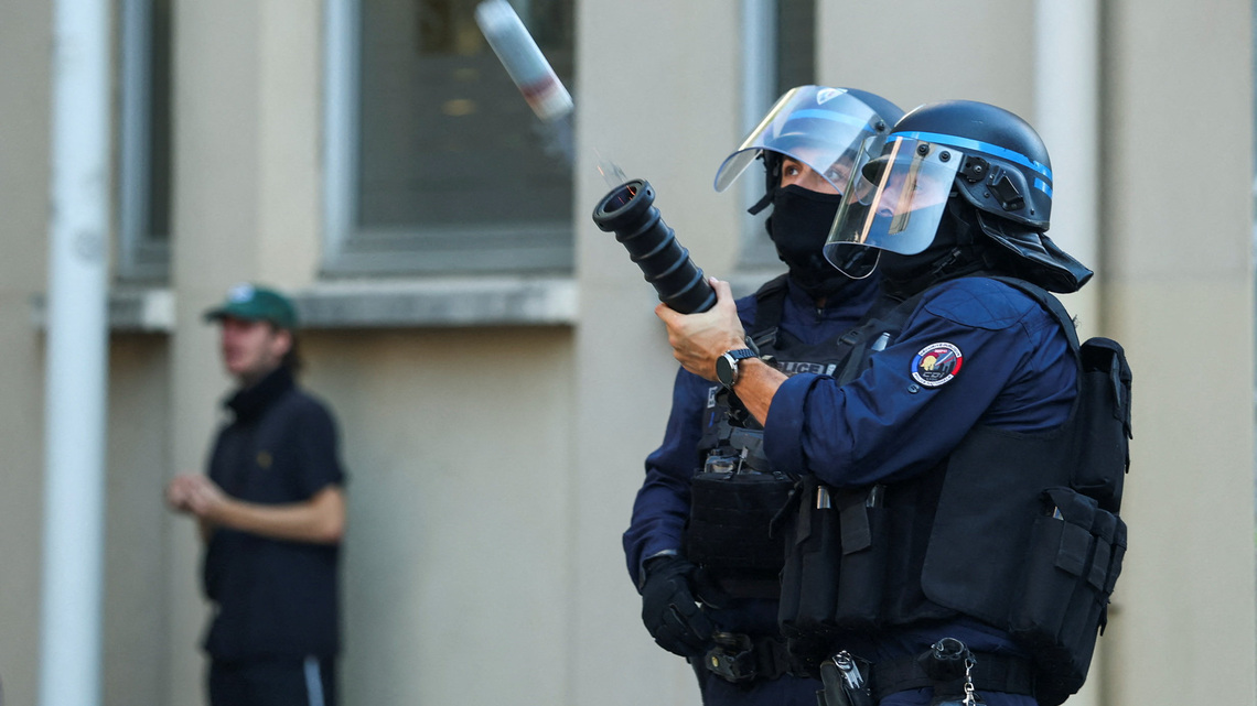 France suspends use of stun grenades to police student protests 