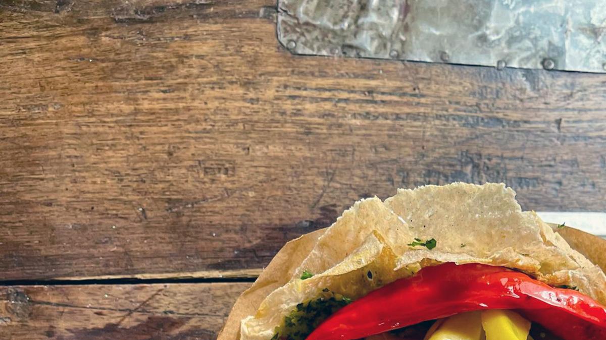 For a different approach, falafel is baked smooth on mini tortillas - rather than shaped into balls - and served with a tomato and pepper salad and a dollop of tahini.