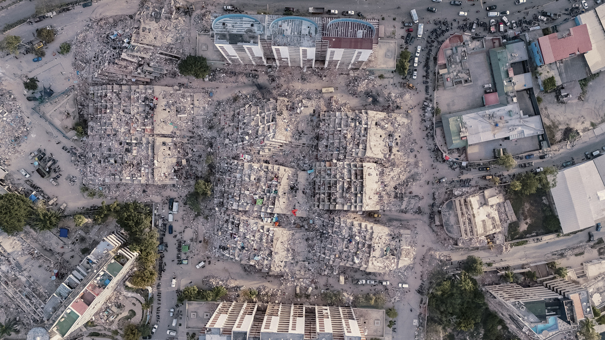 People search for survivors through nine residential buildings that collapsed in last week's earthquakes in La Guaira, Venezuela, on Monday, June 29, 2026. It has been six days since devastating twin earthquakes flattened entire residential neighborhoods in Venezuela, and dozens of new bodies are still being hauled out of the rubble. (Adriana Loureiro Fernandez/The New York Times)