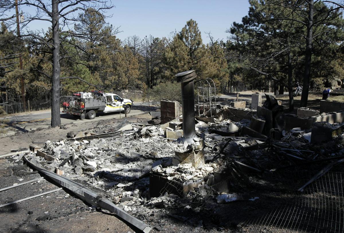  Wildfires like the one in Fourmile Canyon, Colo., in 2010, have been made more likely and worse by greenhouse gas emissions, which increase air temperatures and dry out vegetation. AP Photo/Jae C. Hong 