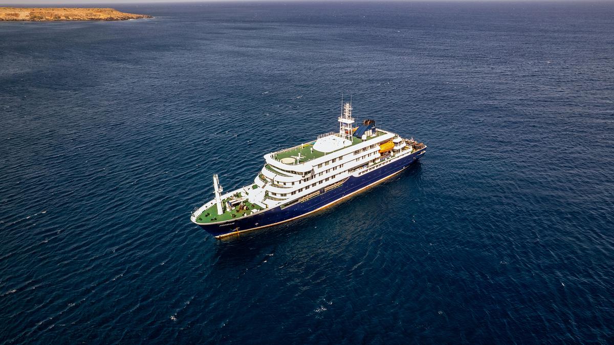 This aerial picture shows a general view of the cruise ship MV Hondius stationary off the port of Praia, the capital of Cape Verde, on May 3, 2026. An outbreak of "severe acute respiratory illness" on board a cruise ship in the Atlantic has left three people dead. (AFP/Getty Images/TNS)