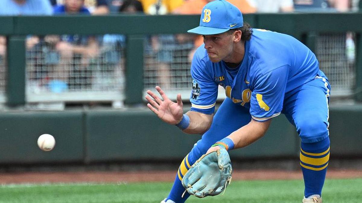  Jun 14, 2025; Omaha, Neb, USA; UCLA Bruins shortstop Roch Cholowsky (1) fields a ground ball against the Murray State Racers during the ninth inning at Charles Schwab Field. Mandatory Credit: Steven Branscombe-Imagn Images | Steven Branscombe-Imagn Images 