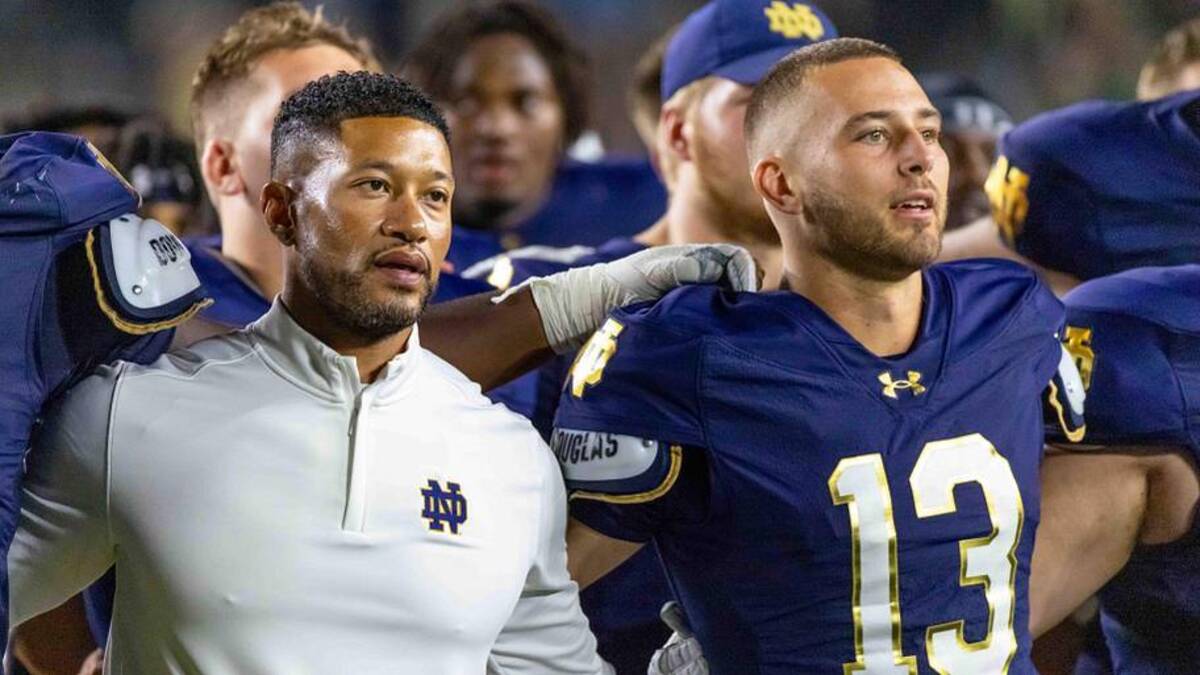  Sep 20, 2025; South Bend, Indiana, USA; Notre Dame Fighting Irish head coach Marcus Freeman and quarterback CJ Carr (13) sing the alma mater after beating the Purdue Boilermakers at Notre Dame Stadium. | Michael Caterina-Imagn Images 