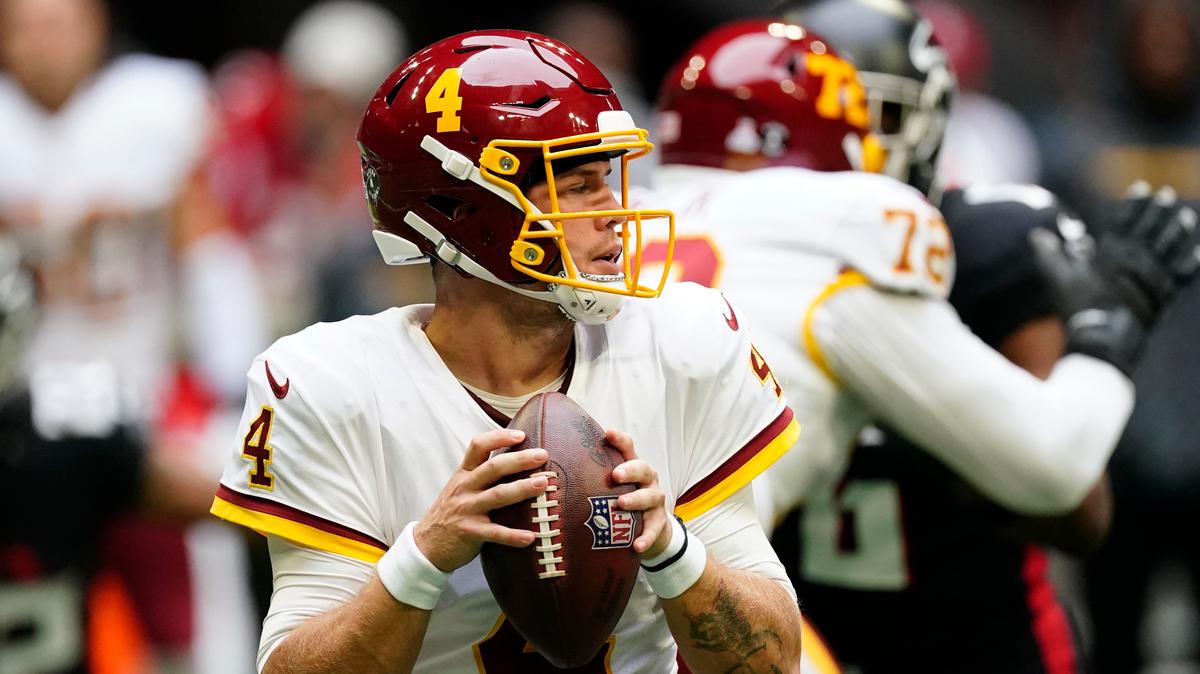 Washington Football Team quarterback Taylor Heinicke (4) works in the pocket against the Atlanta Falcons during the first half of an NFL football game, Sunday, Oct. 3, 2021, in Atlanta. (AP Photo/John Bazemore)
