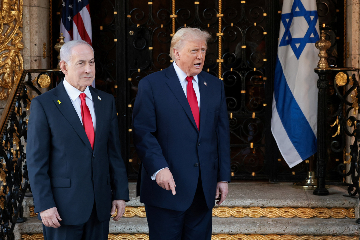 U.S. President Donald Trump speaks next to Israeli Prime Minister Benjamin Netanyahu upon arrival for meetings at Trump's Mar-a-Lago club in Palm Beach, Florida, U.S., December 29, 2025. REUTERS/Jonathan Ernst