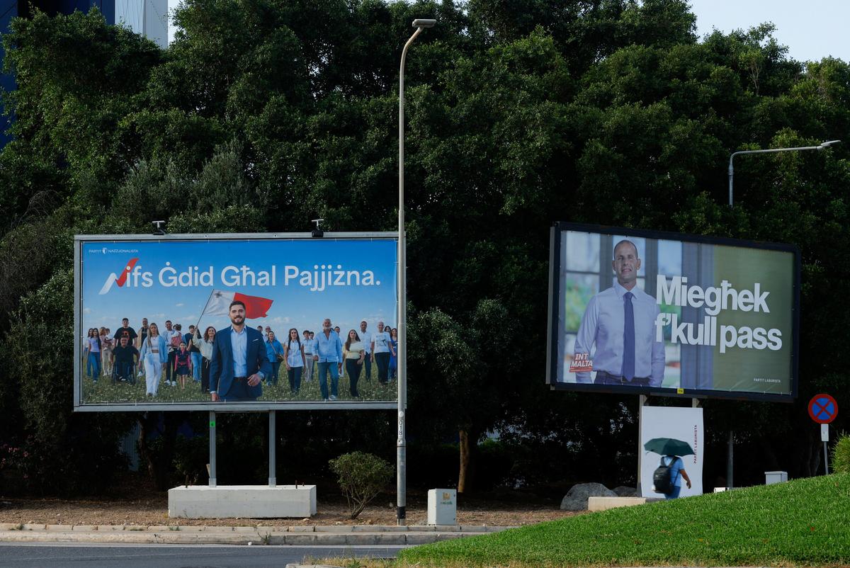 Billboards showing opposition and Nationalist Party leader Alex Borg and Malta's Prime Minister and Labour Party leader Robert Abela ahead of general elections, in Birkirkara, Malta, May 29, 2026. REUTERS/Darrin Zammit Lupi