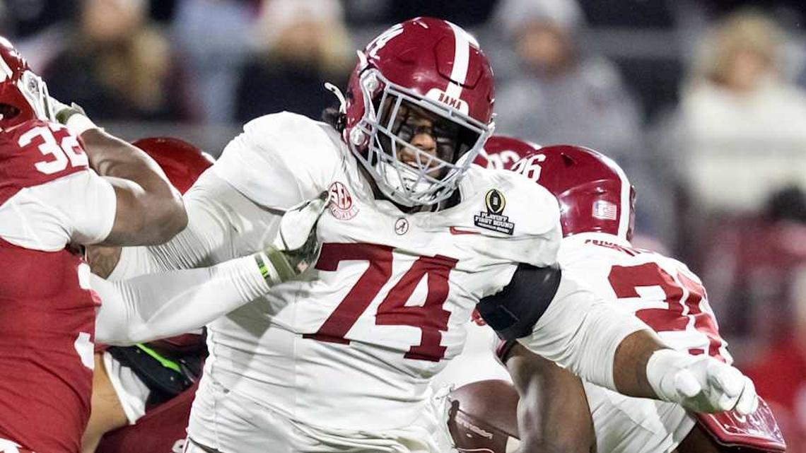 Dec 19, 2025; Norman, OK, USA; Alabama Crimson Tide offensive lineman Kadyn Proctor (74) against the Oklahoma Sooners during the CFP National Playoff First Round at Gaylord Family Oklahoma Memorial Stadium. Mandatory Credit: Mark J. Rebilas-Imagn Images. 