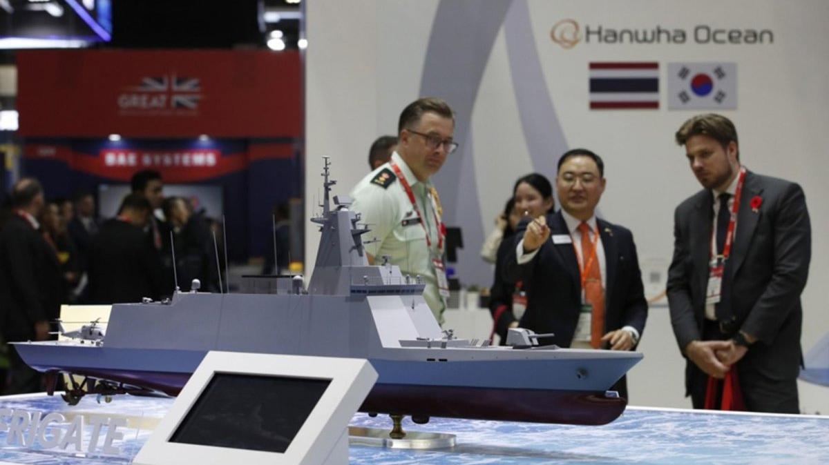 Delegates inspect a model of Thailand's second frigate warship developed by South Korean shipbuilder Hanwha Ocean at the Defense and Security 2025 exhibition in Nonthaburi, on the outskirts of Bangkok, Thailand. Photo by RUNGROJ YONGRIT / EPA