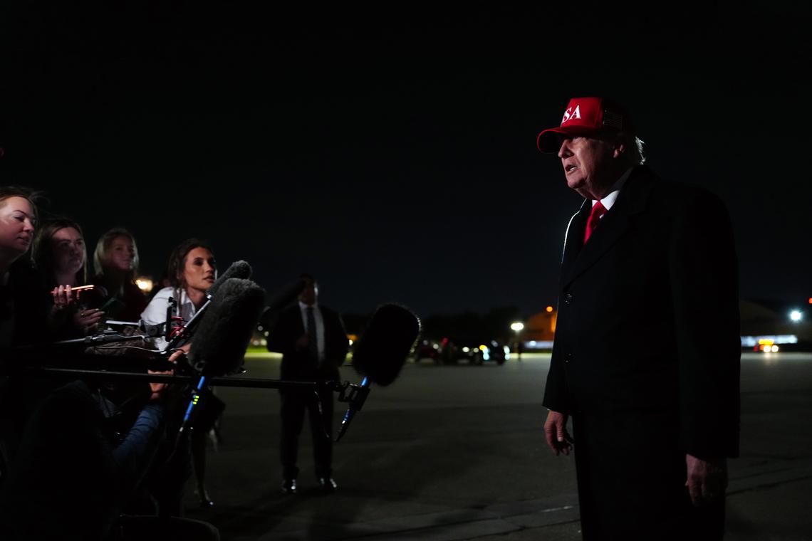 President Donald Trump speaks to reporters upon his arrival at Joint Base Andrews in Maryland on Sunday night, April 12, 2026. Trump on Sunday lashed out at Pope Leo XIV and took credit for his ascension to the papacy. Leo had issued a rare direct criticism of a threat by Trump last week. (Tierney L. Cross/The New York Times)
