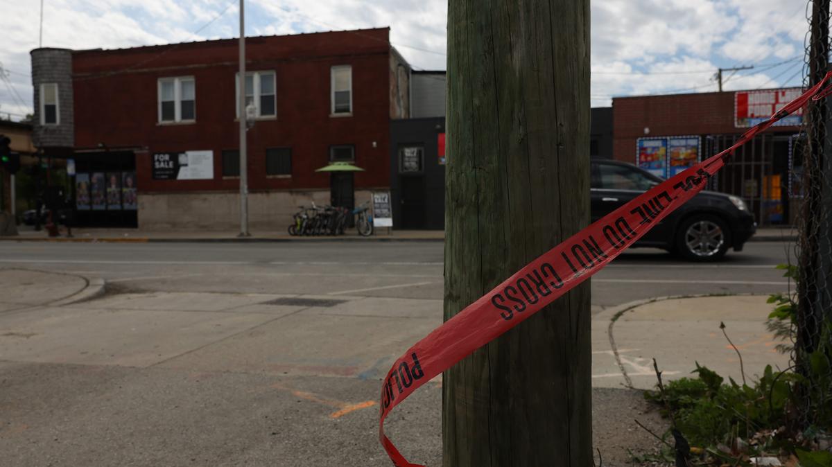Crime scene tape flaps in the wind in the 200 block of North Homan Avenue on May 9, 2026, in Chicago. A rideshare driver and passenger were fatally shot at the intersection of North Homan Avenue and West Lake Street on May 7, 2026, by a gunman in a passing SUV, according to police. (John J. Kim/Chicago Tribune/TNS)