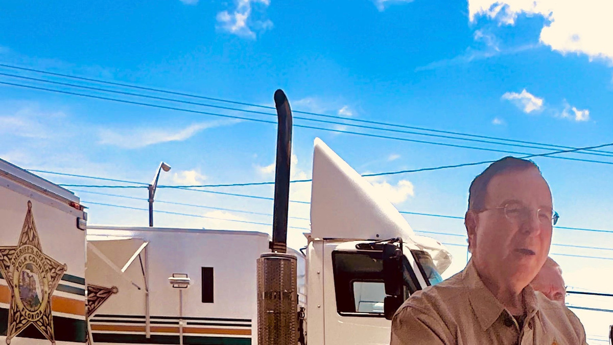 Polk County Sheriff Grady Judd holds a photo of 39-year-old Derrick Byathrite, who he said fatally shot a 20-year-old woman from Lake Wales, before shooting himself then aiming his firearm at responding law enforcement officers.