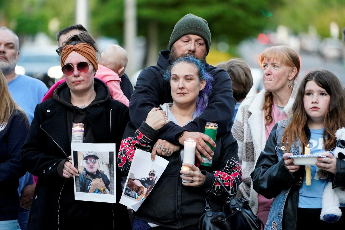 People attend a vigil after a chemical tank rupture at the Nippon Dynawave Packaging pulp and paper mill, in Longview, Washington, U.S., May 26, 2026.  REUTERS/David Ryder