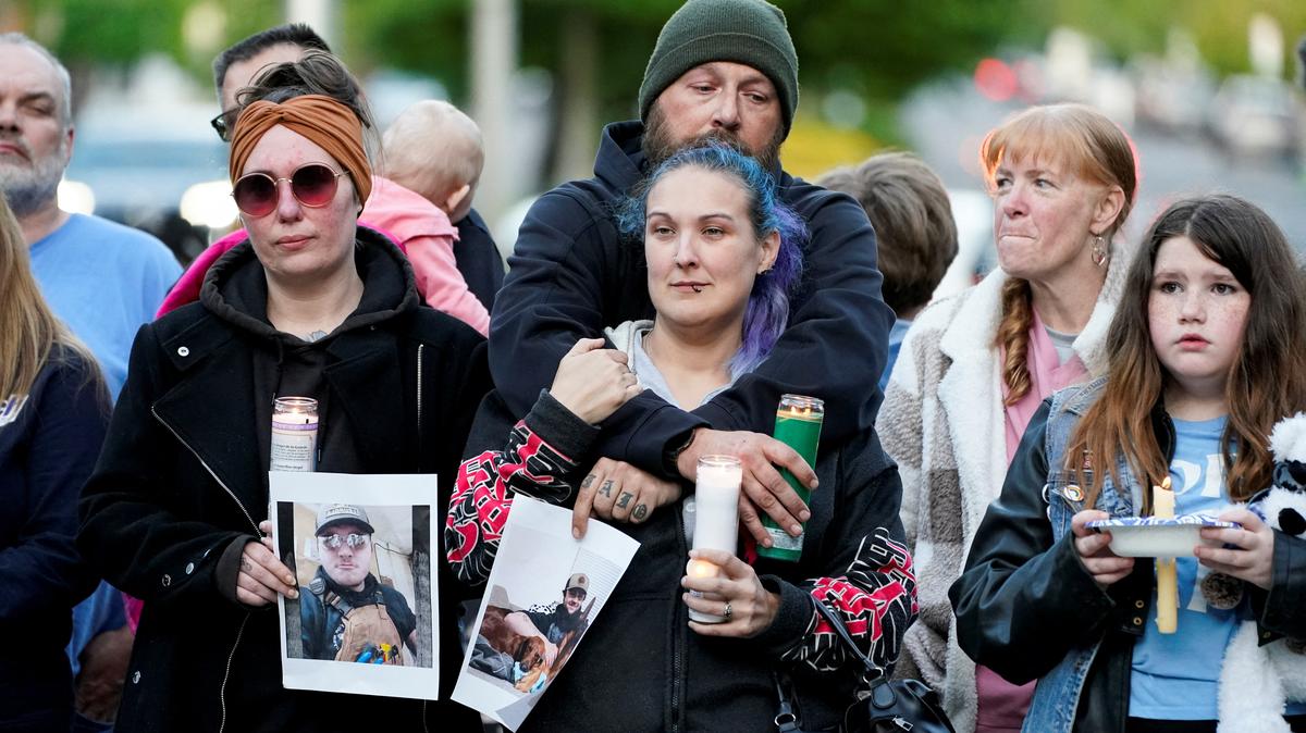 People attend a vigil after a chemical tank rupture at the Nippon Dynawave Packaging pulp and paper mill, in Longview, Washington, U.S., May 26, 2026.  REUTERS/David Ryder