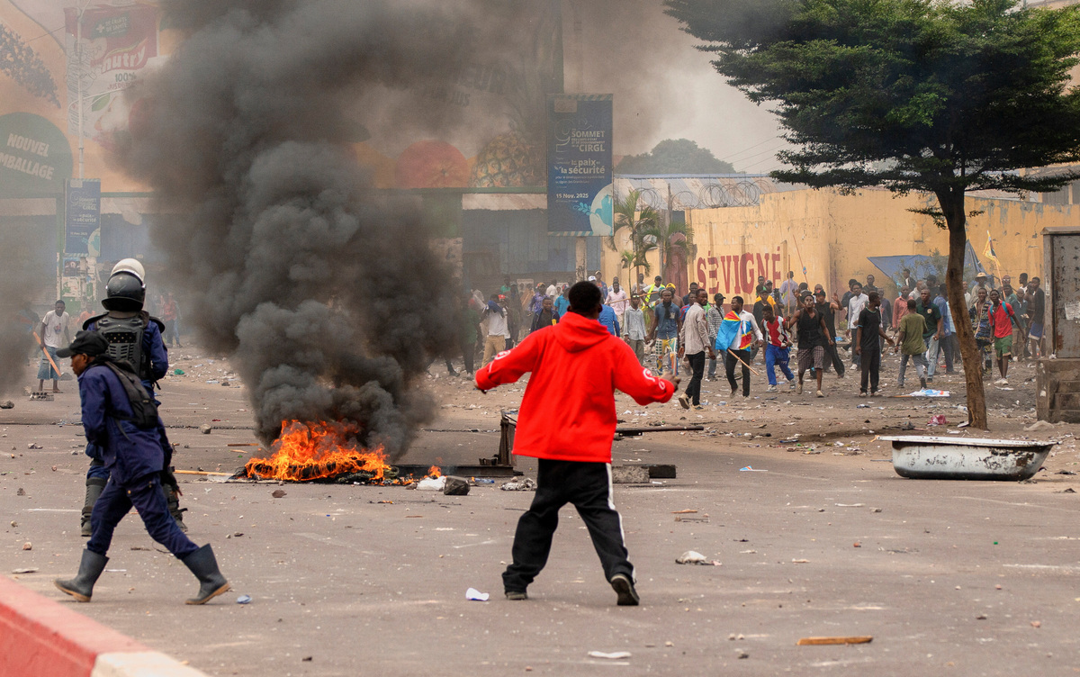 A fire burns during protests near the parliament building in Kinshasa, Democratic Republic of Congo, June 12, 2026.    REUTERS/Aristote Lokinda