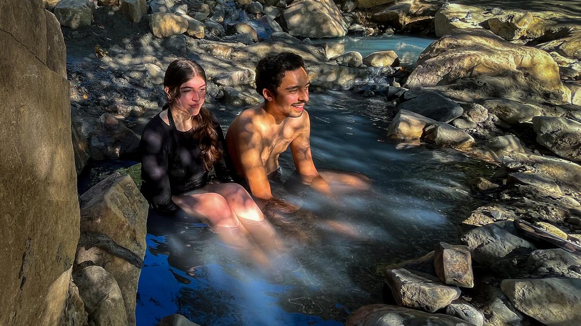 Behind this wealthy SoCal neighborhood, you can soak in a rustic hot spring oasis
