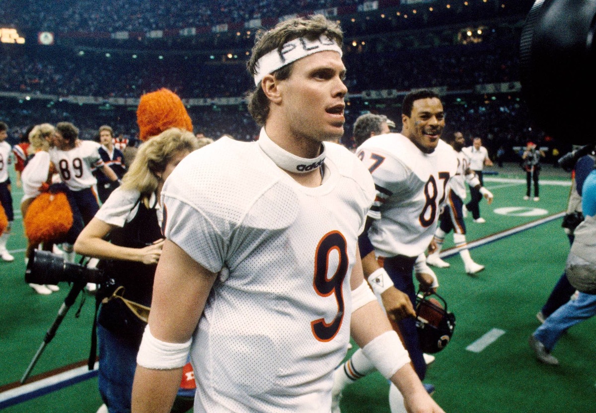  Chicago Bears quarterback Jim McMahon, tight end Emery Moorehead, and teammates walk off the field after defeating the New England Patriots 46-10 to win Super Bowl XX at the Superdome. Manny Rubio-USA TODAY Sports