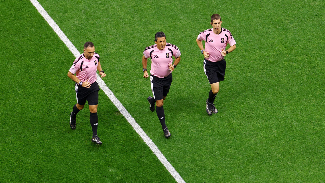 Soccer-The World Cup's hidden runners: referees keep pace with players and pressure 