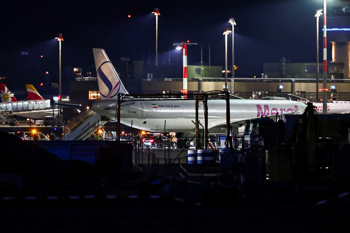 A convoy next to a plane after it landed, carrying an Iranian delegation led by chief negotiator Mohammad Baqer Qalibaf and Foreign Minister Abbas Araqchi, at the Zurich International Airport in Zurich, Switzerland, June 20, 2026. REUTERS/Denis Balibouse