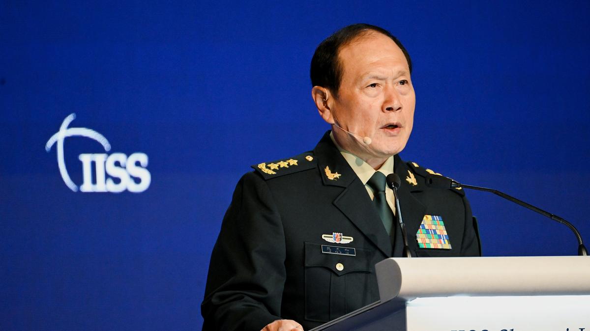 FILE PHOTO: China's State Councilor and Defence Minister General Wei Fenghe speaks at a plenary session during the 19th Shangri-La Dialogue in Singapore June 12, 2022. REUTERS/Caroline Chia/File Photo