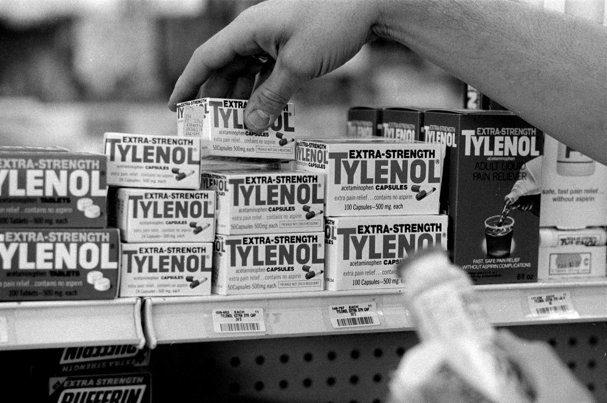 Pharmacist Dennis E. Jordan checks lot codes on bottles of Extra-Strength Tylenol at the Westmont Pharmacy as he removes them from the shelves on Sept. 30, 1982. (John Dziekan/Chicago Tribune)