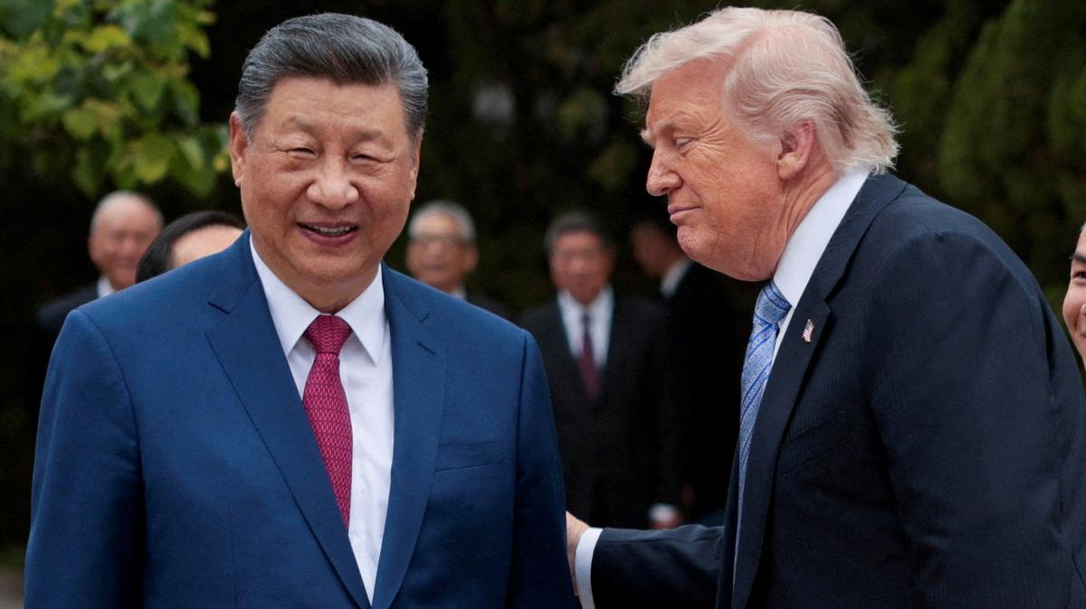 FILE PHOTO: FILE PHOTO: U.S. President Donald Trump speaks with Chinese President Xi Jinping while leaving after a visit to the Zhongnanhai Garden in Beijing, China, May 15, 2026. REUTERS/Evan Vucci/Pool/File Photo/File Photo