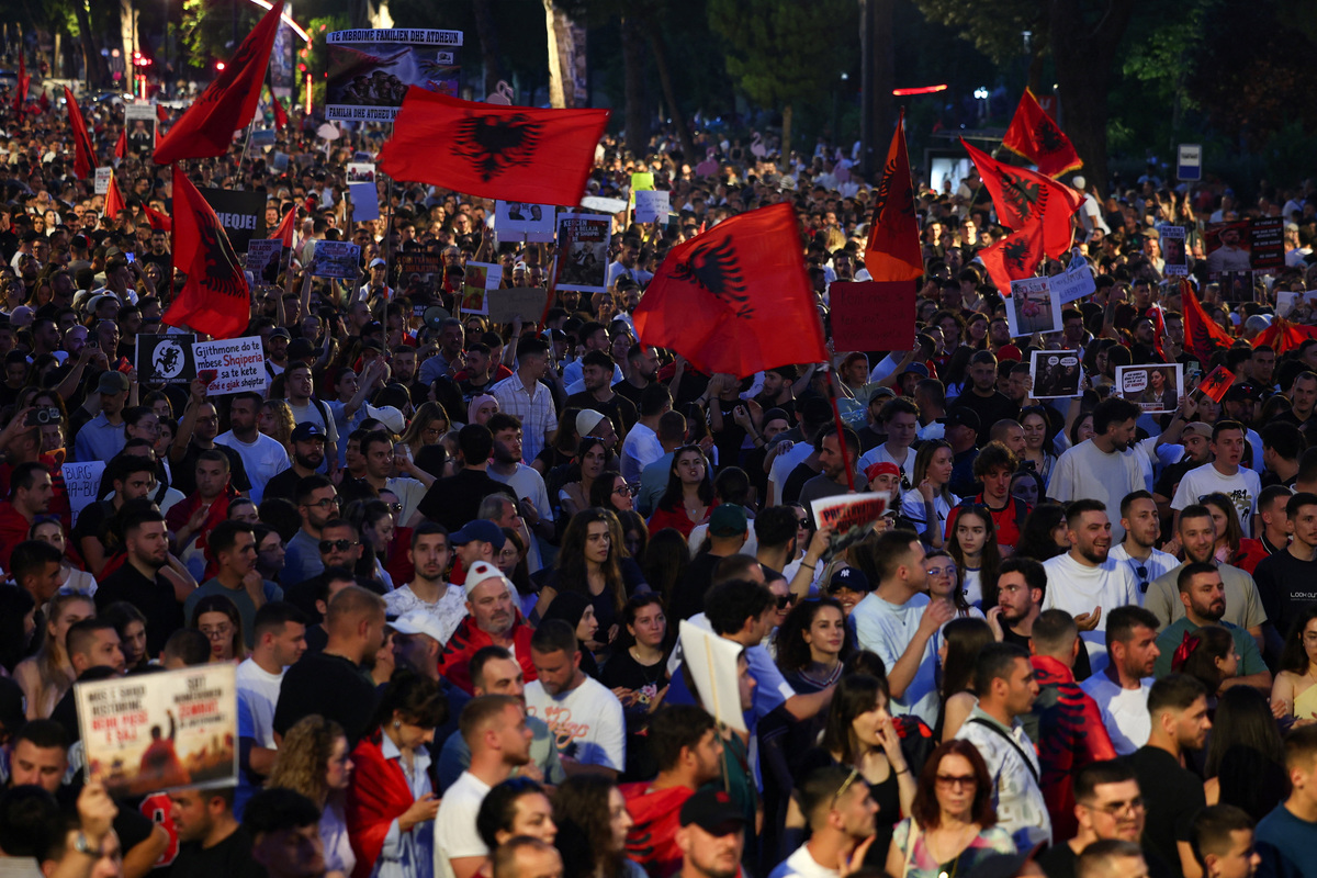 Protesters wave Albanian National flags during a protest against a luxury resort, a plan by a company linked to U.S. President Donald Trump's son-in-law, Jared Kushner, on an environmentally sensitive part of the Adriatic coast, in Tirana, Albania, June 9, 2026. REUTERS/Florion Goga