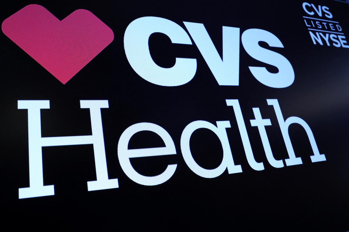 A screen displays the logo and trading information for CVS Health on the floor at the New York Stock Exchange (NYSE) in New York City, U.S., December 6, 2023.  REUTERS/Brendan McDermid