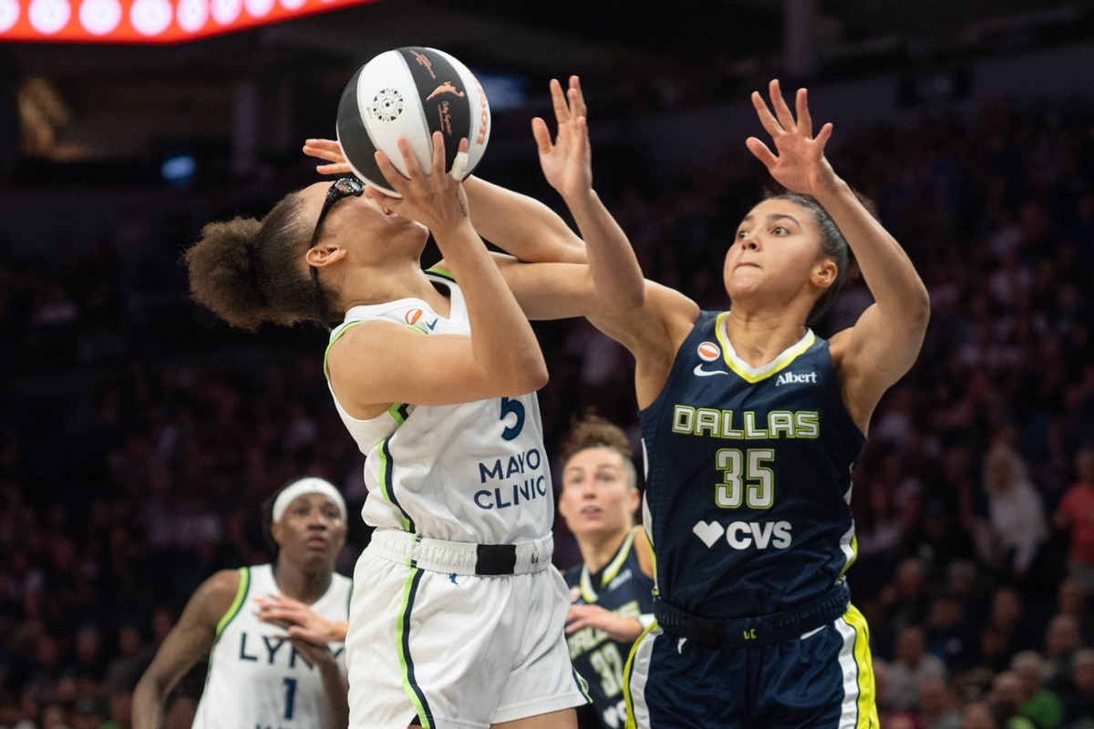  Jun 9, 2026; Minneapolis, Minnesota, USA; Minnesota Lynx guard Olivia Miles (5) is fouled by Dallas Wings guard Azzi Fudd (35) in the third quarter at Target Center. Mandatory Credit: Matt Blewett-Imagn Images 