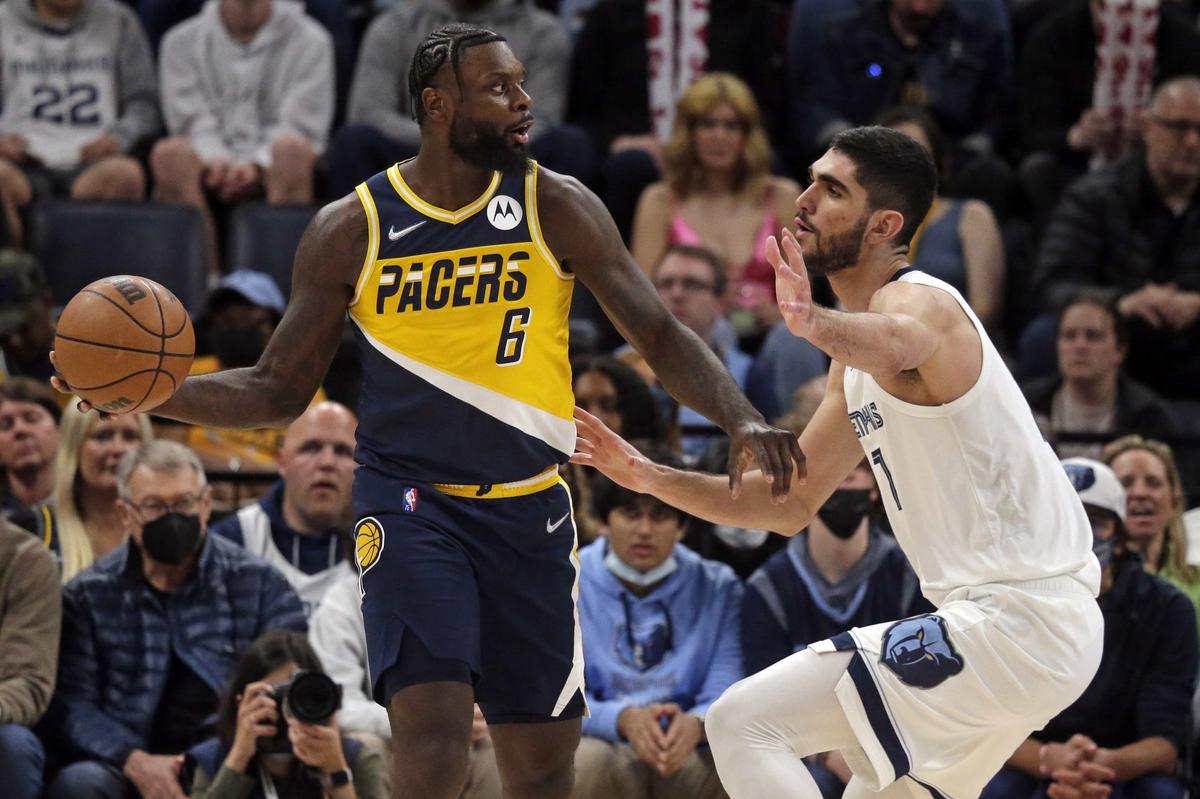 Mar 24, 2022; Memphis, Tennessee, USA; Indiana Pacers forward Lance Stephenson (6) passes the ball as Memphis Grizzlies forward Santi Aldama (7) defends during the second half at FedExForum. Mandatory Credit: Petre Thomas-USA TODAY Sports
