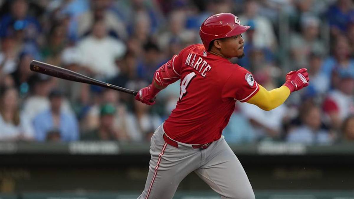  Cincinnati Reds hitter Noelvi Marte (4) hits against the Chicago Cubs in the second inning at Sloan Park. | Rick Scuteri-Imagn Images 