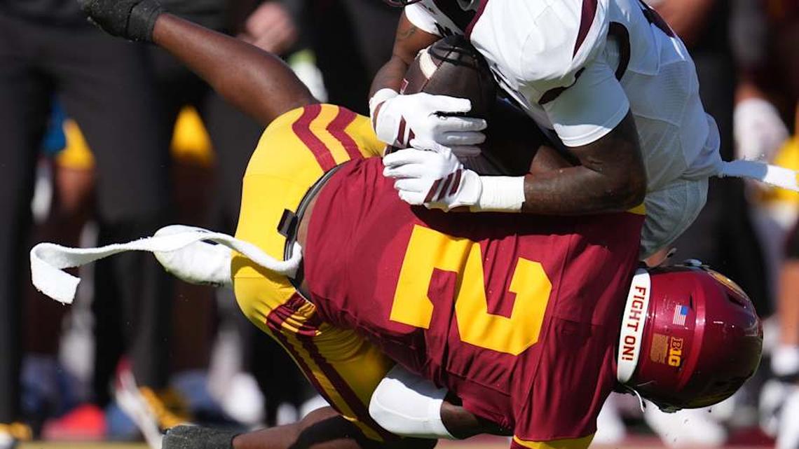  Aug 30, 2025; Los Angeles, California, USA; Missouri State Bears wide receiver Jmariyae Robinson (0) is tackled by Southern California Trojans cornerback DJ Harvey (2) n the first half at United Airlines Field at Los Angeles Memorial Coliseum. Mandatory Credit: Kirby Lee-Imagn Images | Kirby Lee-Imagn Images 